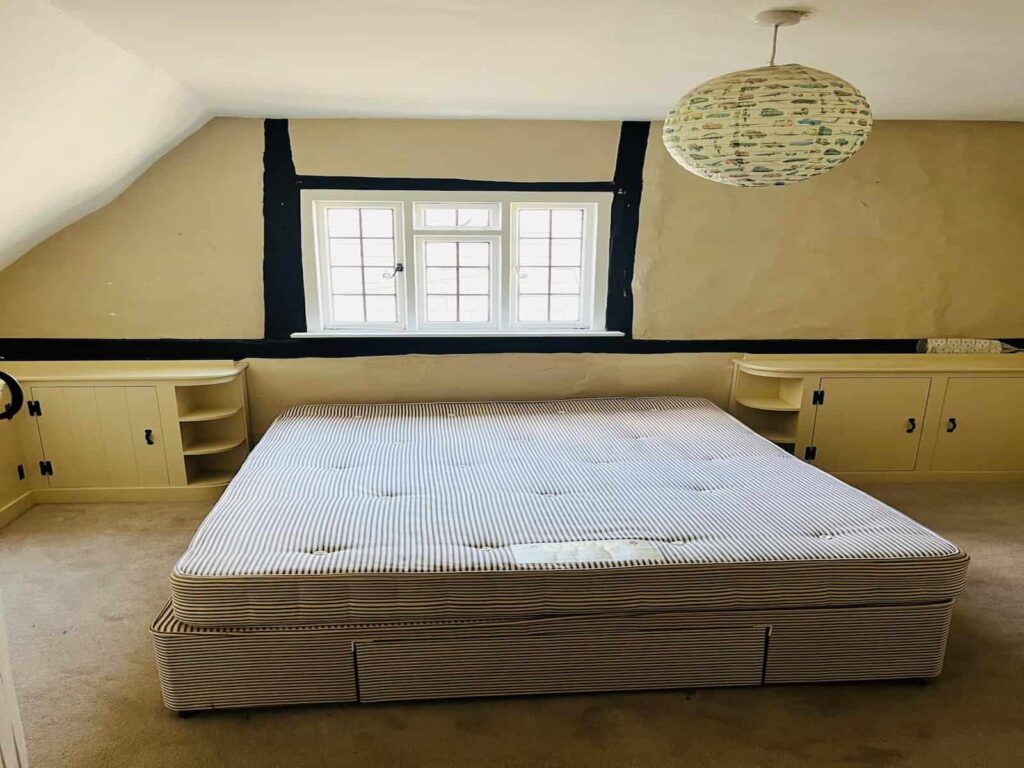 Large bedroom with bed prepared for a house removal in Ruislip Manor HA4